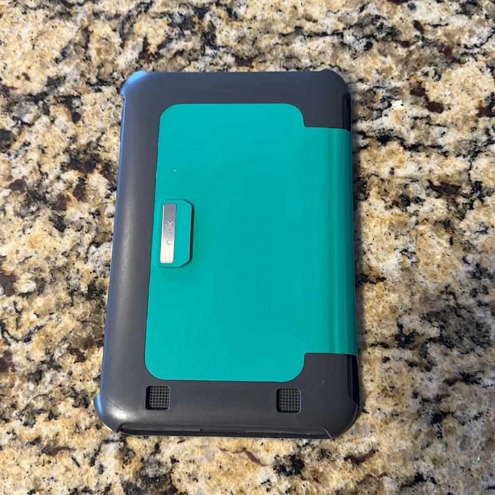 Nook reader with green case and charger cord